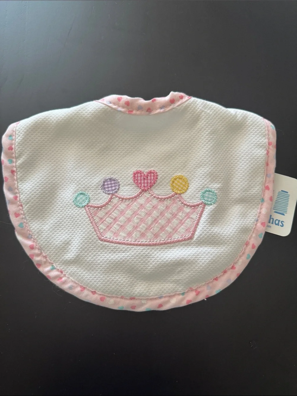 White Bib with Pink Trim and Pastel Crown Applique